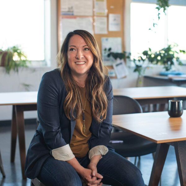 Person sitting at table in calm office.